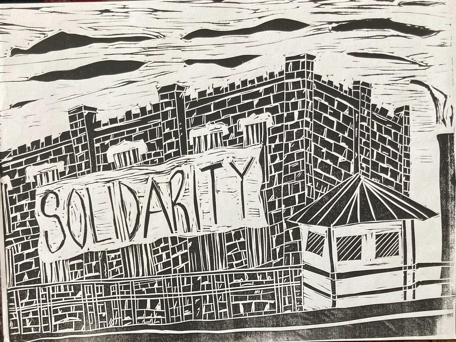 Lino-cut illustration of a solidarity banner across prison walls